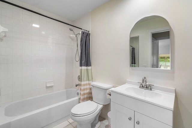 full bath featuring toilet, tile patterned floors, vanity, and shower / bath combo with shower curtain
