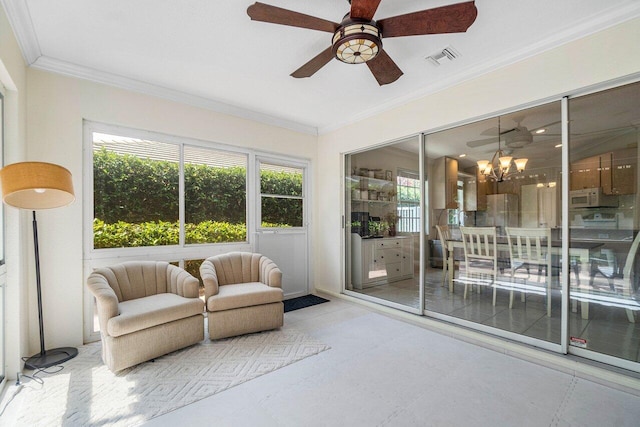 sunroom / solarium with visible vents and ceiling fan with notable chandelier