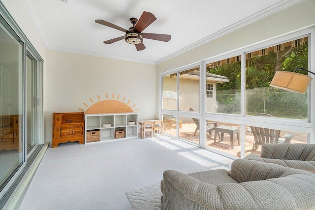 sunroom / solarium featuring ceiling fan and exterior kitchen