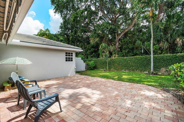 view of patio featuring fence