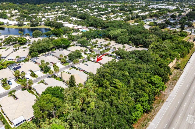 bird's eye view featuring a water view and a residential view