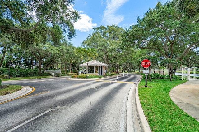 view of street with traffic signs and curbs