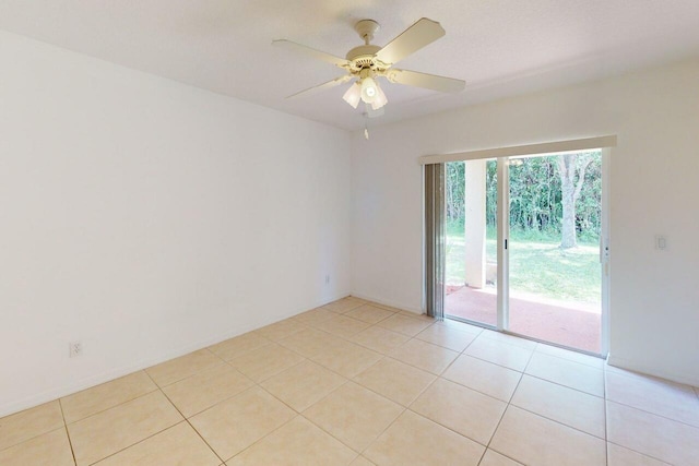 unfurnished room featuring light tile patterned floors and a ceiling fan