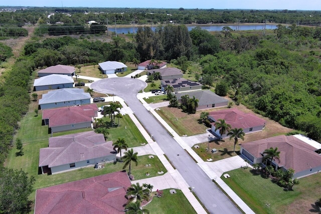 aerial view featuring a water view and a residential view