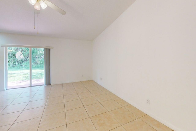 unfurnished room featuring light tile patterned floors and a ceiling fan