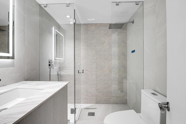 6560 Las Flores Dr, Boca Raton, FL 33433 - full bath featuring tile walls, a shower stall, toilet, vanity, and tile patterned flooring