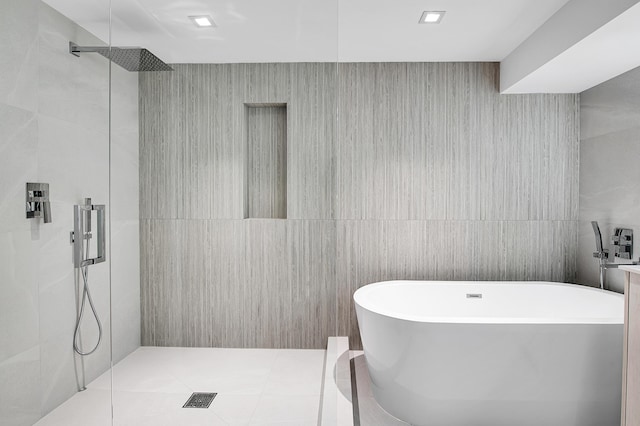 6560 Las Flores Dr, Boca Raton, FL 33433 - bathroom featuring tile walls, a freestanding bath, and walk in shower