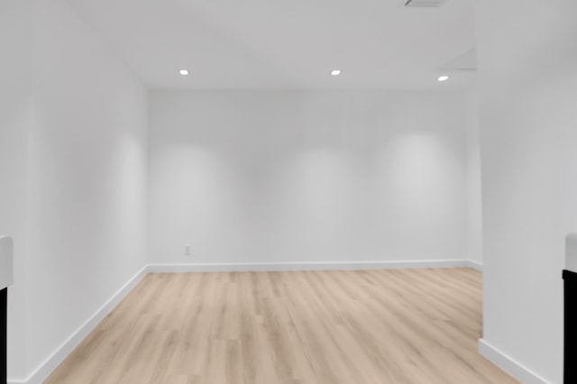 6560 Las Flores Dr, Boca Raton, FL 33433 - empty room with light wood-style flooring, baseboards, and recessed lighting