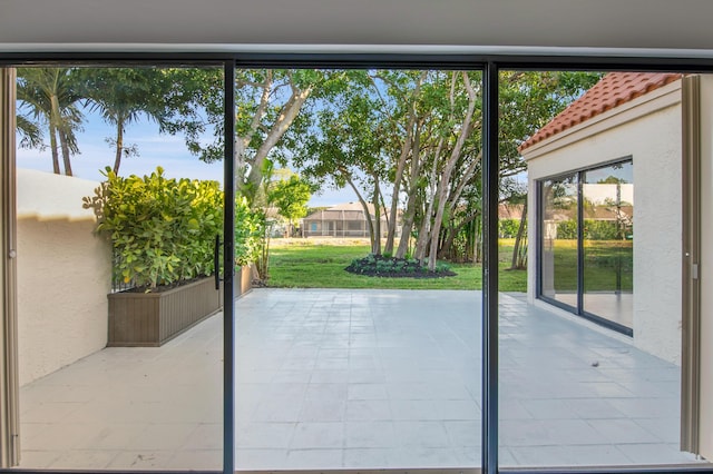6560 Las Flores Dr, Boca Raton, FL 33433 - doorway to outside with plenty of natural light and light tile patterned flooring