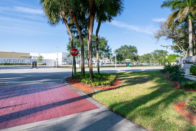 6560 Las Flores Dr, Boca Raton, FL 33433 - view of asphalt road with traffic signs