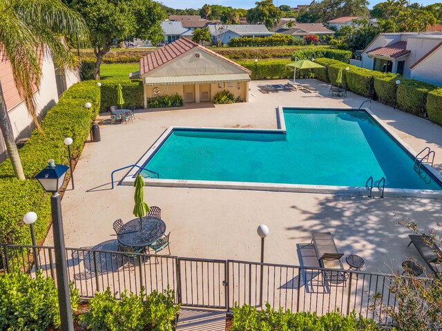 6560 Las Flores Dr, Boca Raton, FL 33433 - community pool featuring a patio and fence