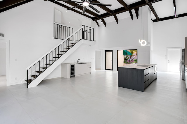 6560 Las Flores Dr, Boca Raton, FL 33433 - staircase featuring high vaulted ceiling, beam ceiling, wine cooler, a ceiling fan, and bar