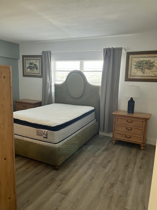 bedroom featuring wood finished floors