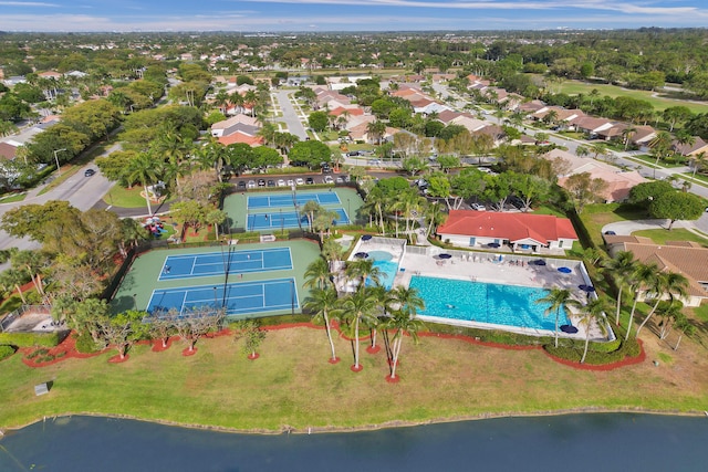 birds eye view of property featuring a water view and a residential view