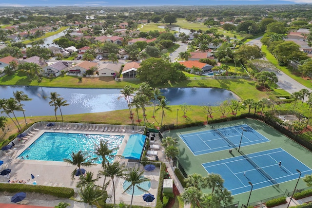 birds eye view of property with a water view and a residential view