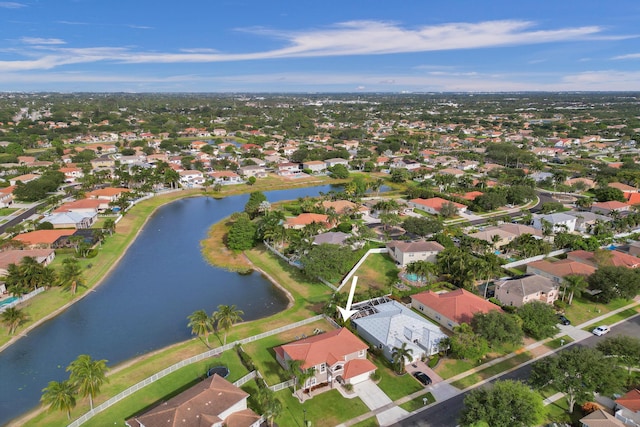 bird's eye view featuring a water view and a residential view