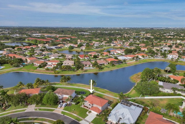 birds eye view of property featuring a water view and a residential view