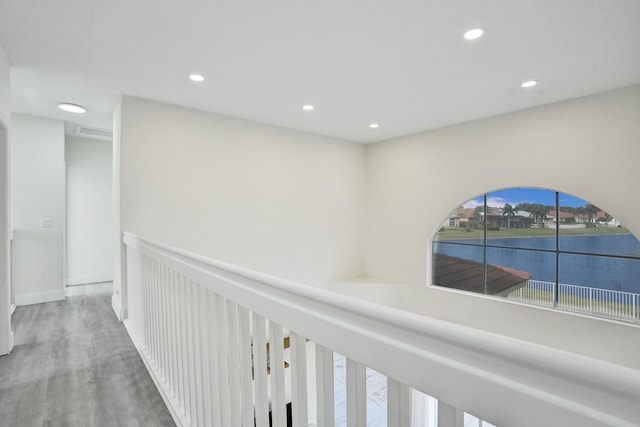 hall featuring visible vents, recessed lighting, and wood finished floors
