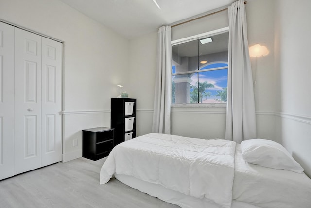 bedroom featuring a closet and wood finished floors