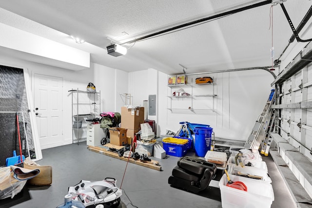 garage featuring electric panel and a garage door opener