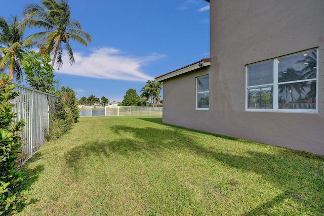 view of yard with a fenced backyard