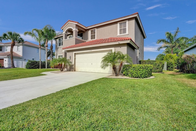 mediterranean / spanish-style home with concrete driveway, a front yard, stucco siding, and a tiled roof