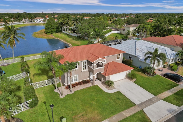 birds eye view of property featuring a water view and a residential view