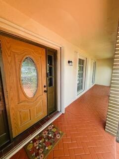 9170 NW 21st Mnr, Sunrise, FL 33322 - doorway to property with a porch