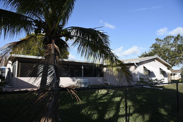 9170 NW 21st Mnr, Sunrise, FL 33322 - view of home's exterior with a sunroom and stucco siding