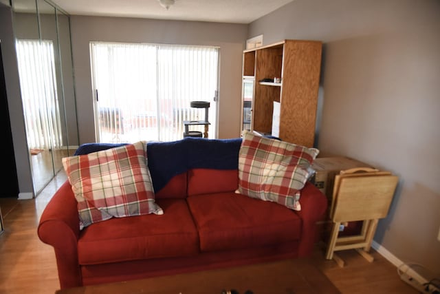 9170 NW 21st Mnr, Sunrise, FL 33322 - living area with plenty of natural light and wood finished floors