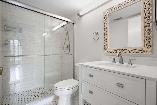 full bath with vanity, toilet, visible vents, and a shower stall