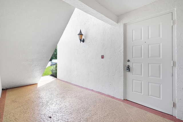 doorway to property with stucco siding