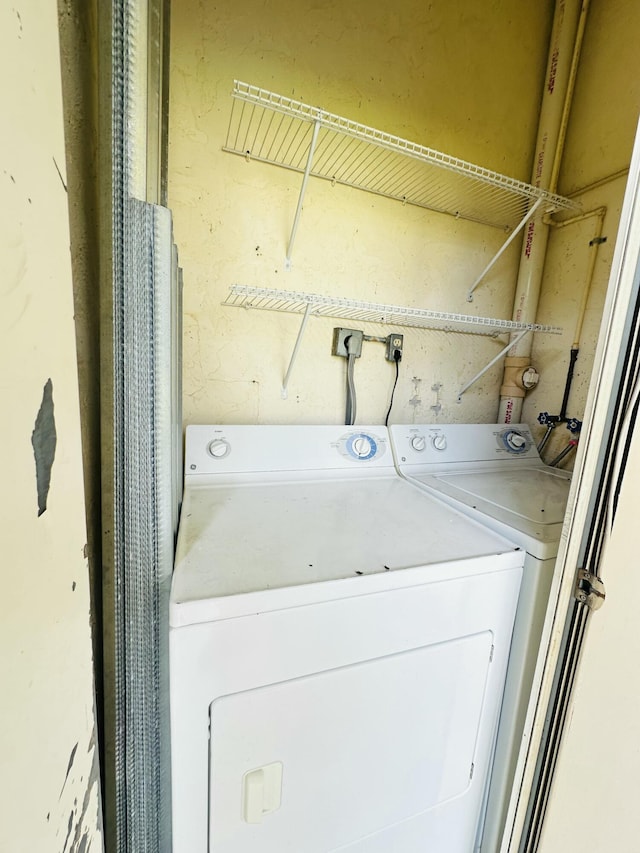 clothes washing area featuring washer hookup and laundry area