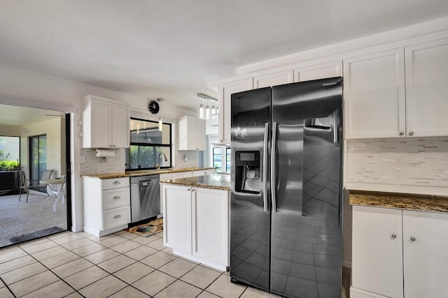 kitchen with black refrigerator with ice dispenser, dishwasher, white cabinetry, backsplash, and light tile patterned flooring