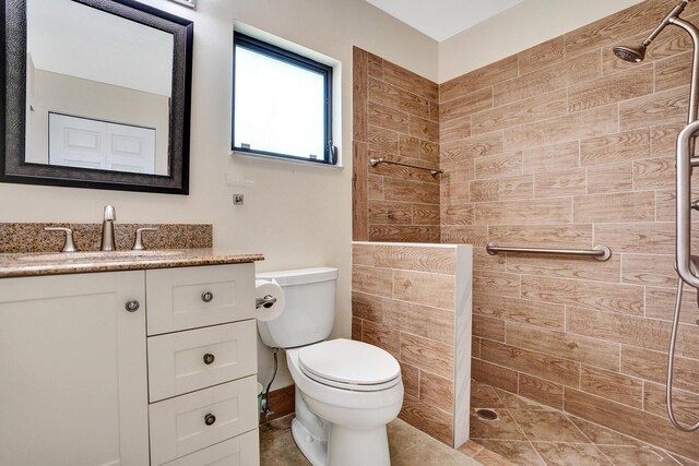 full bath with a walk in shower, toilet, and vanity