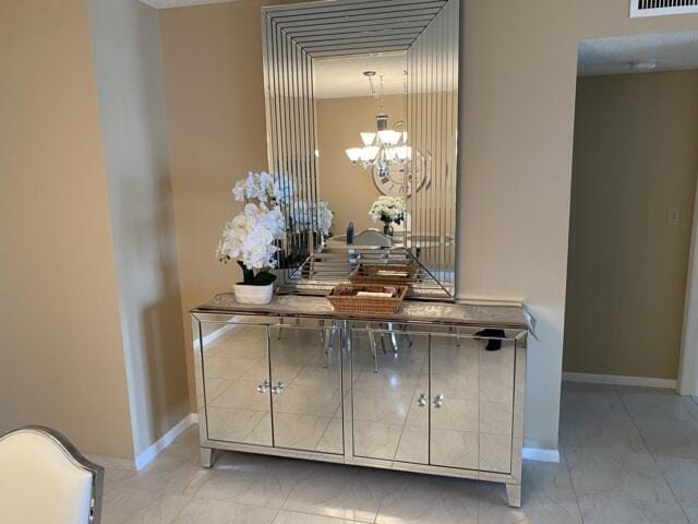 7076 Huntington Ln Unit 805, Delray Beach, FL 33446 - room details with a chandelier and baseboards
