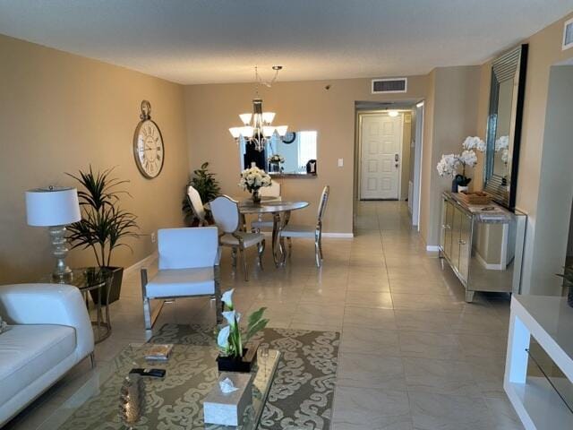 7076 Huntington Ln Unit 805, Delray Beach, FL 33446 - living area with marble finish floor, an inviting chandelier, baseboards, and visible vents