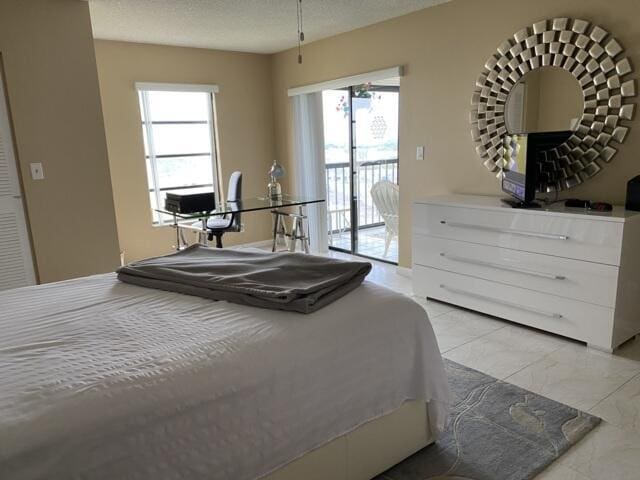 7076 Huntington Ln Unit 805, Delray Beach, FL 33446 - bedroom featuring multiple windows, a textured ceiling, access to outside, and marble finish floor