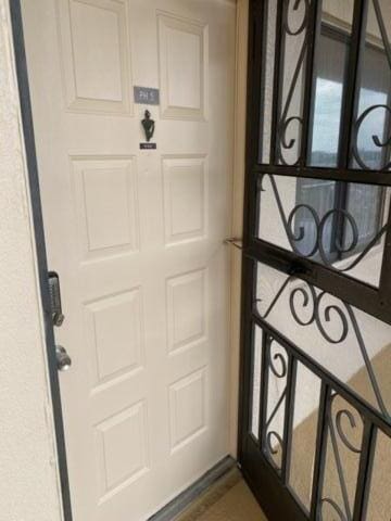 7076 Huntington Ln Unit 805, Delray Beach, FL 33446 - view of exterior entry with a garage