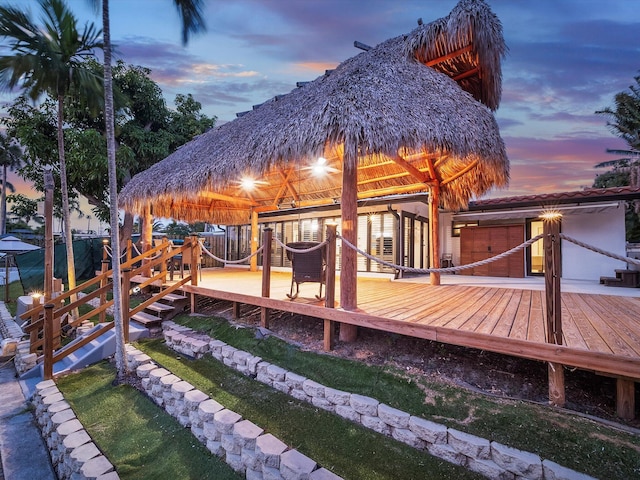 back of property featuring a wooden deck