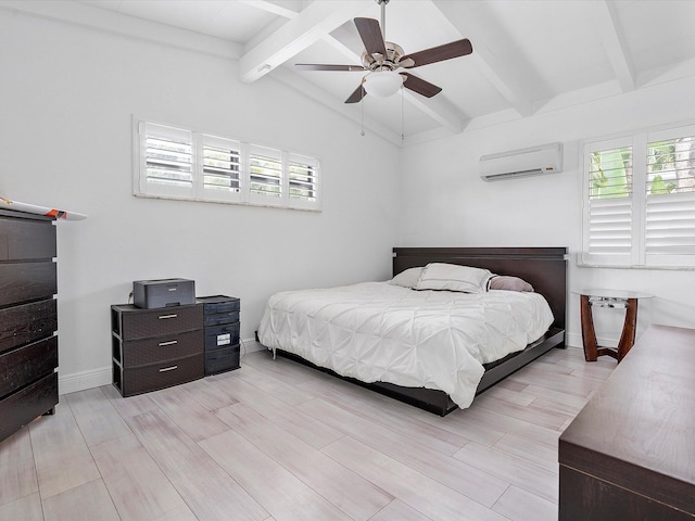 bedroom featuring multiple windows, light wood-style flooring, a wall unit AC, and vaulted ceiling with beams