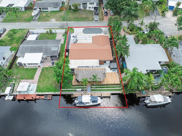 drone / aerial view featuring a water view and a residential view