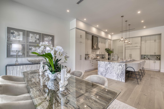 dining room with recessed lighting, visible vents, and light wood-style floors