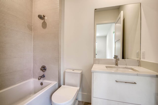 bathroom with toilet, vanity, and shower / washtub combination
