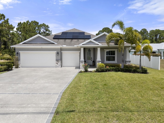 view of front of property with an attached garage, concrete driveway, solar panels, stucco siding, and a porch