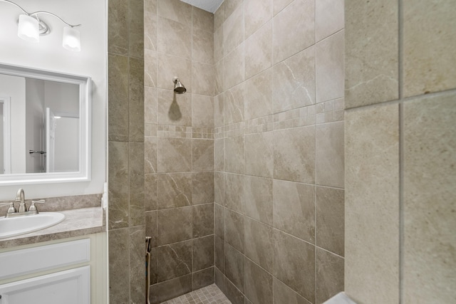bathroom featuring a stall shower and vanity