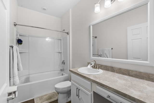 bathroom featuring vanity, toilet, and washtub / shower combination