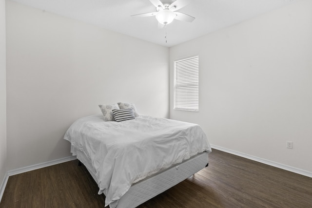 bedroom with baseboards, wood finished floors, and ceiling fan