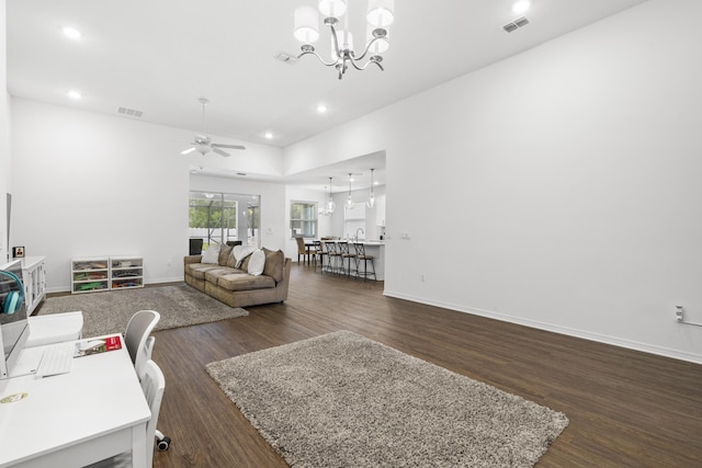 living area with dark wood finished floors, ceiling fan, recessed lighting, and baseboards