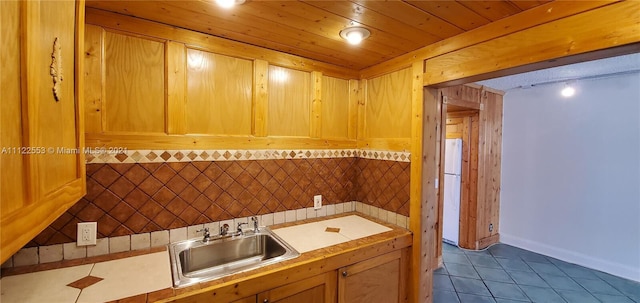 17 Brighton A 17, Boca Raton, FL 33434 - bathroom featuring a sink, tile patterned flooring, baseboards, and a wainscoted wall